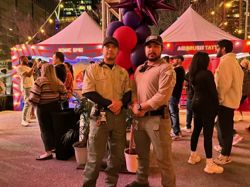 Security officers working an outdoor evening event