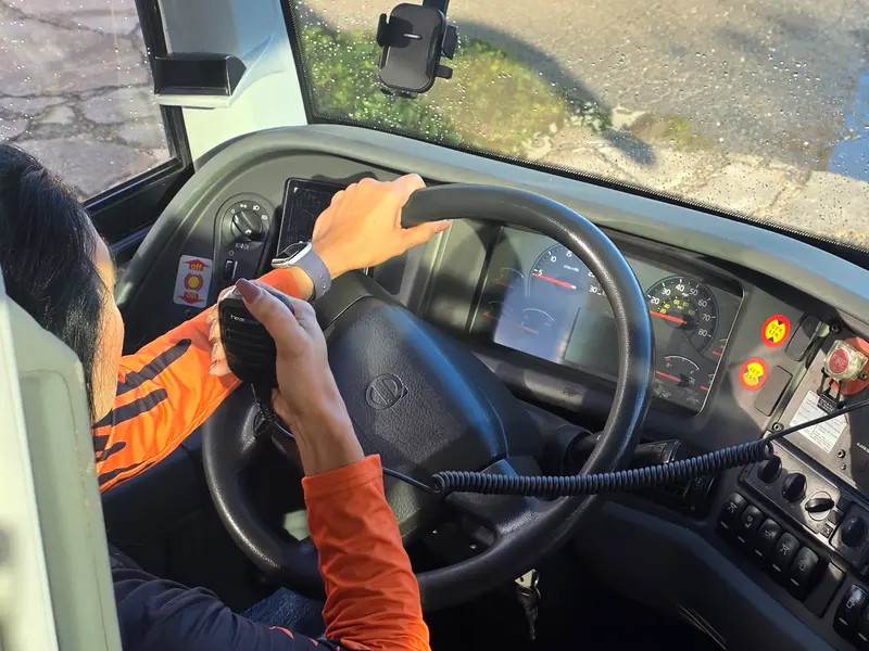 Driver using a HearClear radio while at the wheel